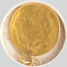 1857-C gold dollar on a gold chain.